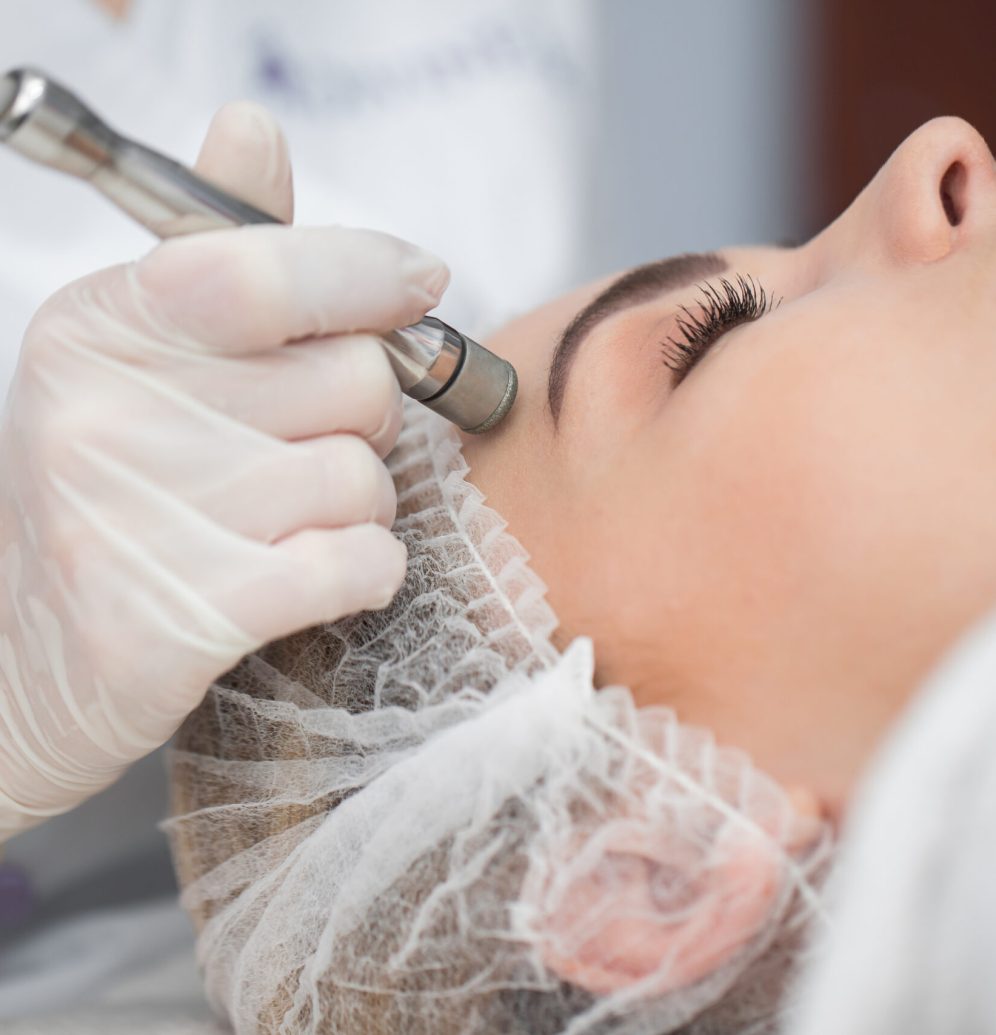 Diamond microdermabrasion, peeling cosmetic. woman during a microdermabrasion treatment in beauty salon